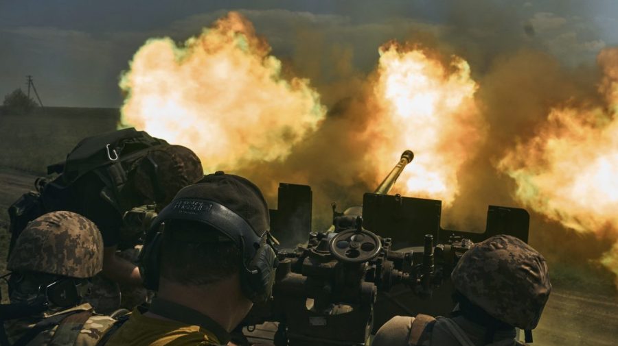 FILE - Ukrainian soldiers fire a cannon near Bakhmut, an eastern city where fierce battles against Russian forces have been taking place, in the Donetsk region, Ukraine, May 15, 2023. (AP Photo/Libkos, File)