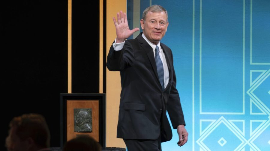 File - Supreme Court Chief Justice John Roberts waves to the crowd after he received the Henry J. Friendly Medal during the American Law Institute's annual dinner in Washington, Tuesday, May 23, 2023. (AP Photo/Jose Luis Magana)