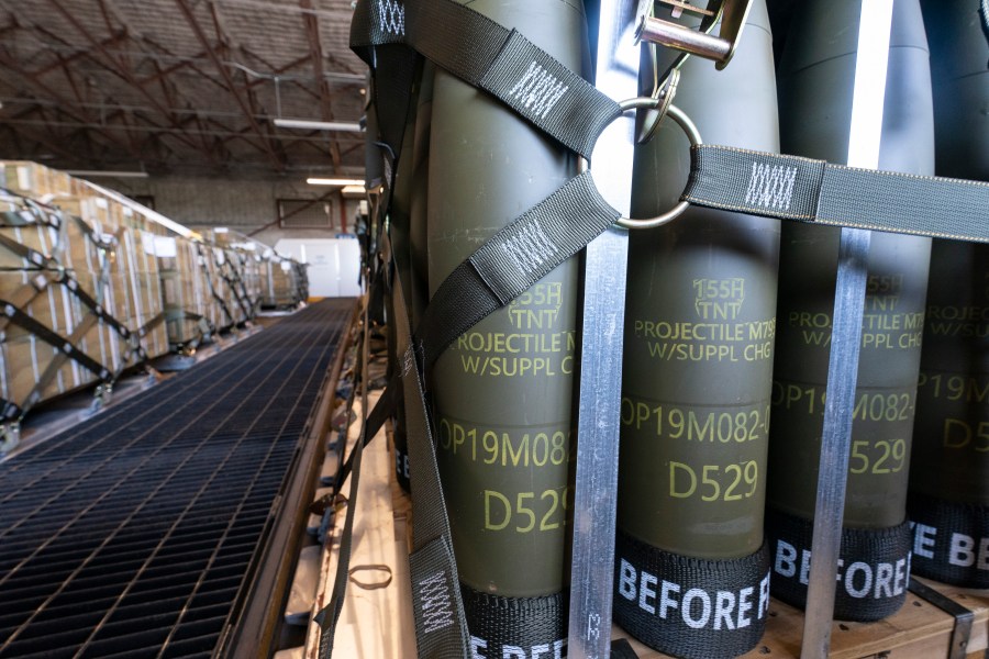 FILE - Pallets of 155 mm shells ultimately bound for Ukraine are loaded by the 436th Aerial Port Squadron, April 29, 2022, at Dover Air Force Base, Del. U.S. officials say a military aid package for Ukraine that is expected to be announced this week will total up to $300 million, and will include additional munitions for drones. (AP Photo/Alex Brandon, File)