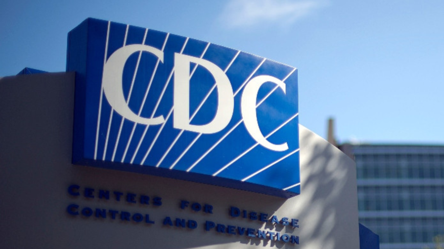 The blue-and-white CDC logo is seen on a sign.