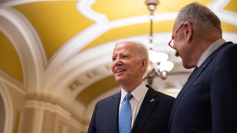 President Biden speaks to reporters alongside Majority Leader Chuck Schumer (D-N.Y.)