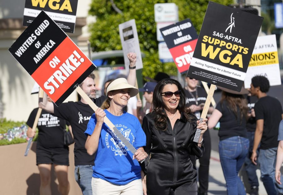 Meredith Stiehm, left, president of Writers Guild of America West, and Fran Drescher, president of SAG-AFTRA, take part in a rally by striking writers outside Paramount Pictures studio in Los Angeles on May 8, 2023.