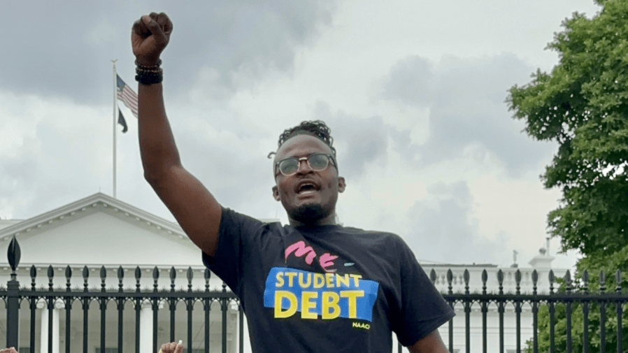 Wisdom O. Cole, NAACP National Director of Youth & College, led chants with others outside the White House on Tuesday for student loan debt relief.