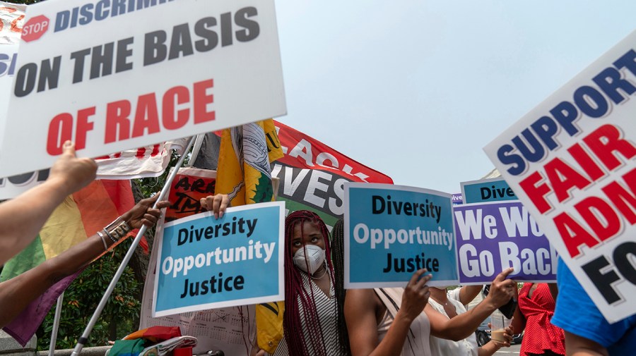 People protest outside of the Supreme Court in Washington, Thursday, June 29, 2023.