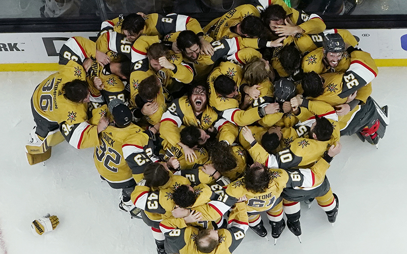 An overhead angle of Vegas Golden Knights players hugging and celebrating after winning the Stanley Cup