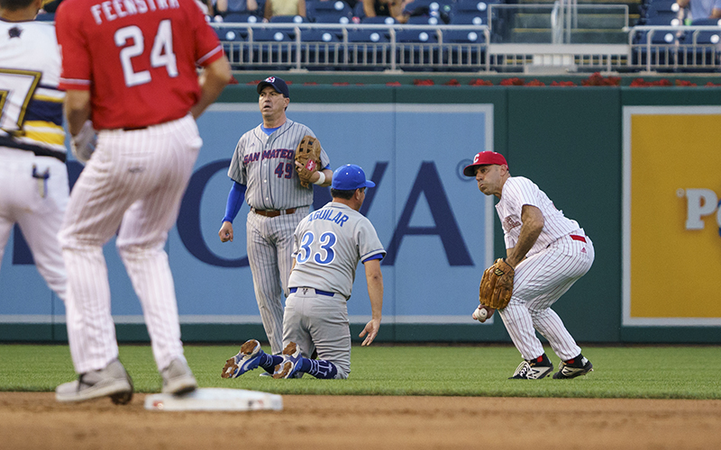 Rep. Jimmy Panetta (D-Calif.) throws the ball to the infield during the Congressional Baseball Game