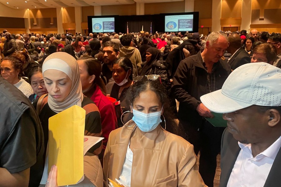 Hundreds of people become U.S. citizens during a naturalization ceremony at a convention center in Saint Paul, Minn., on March 9, 2023. The U.S. citizenship test is being updated and some immigrants and advocates worry the changes will hurt test-takers with lower levels of English proficiency. The test is one of the final steps toward citizenship — a months-long process that requires legal permanent residency for years before applying. (AP Photo/Trisha Ahmed)