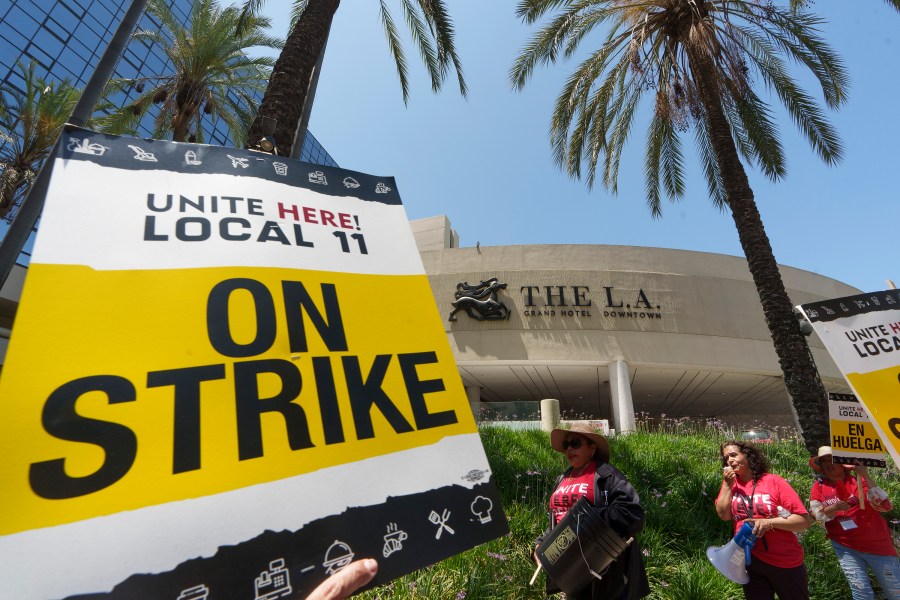 Striking hotel workers rally outside The L.A. Grand Hotel Downtown, Tuesday, July 4, 2023, in downtown Los Angeles. (AP Photo/Damian Dovarganes)