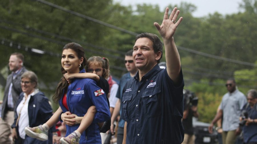 Republican presidential candidate and Florida Gov. Ron DeSantis and his wife Casey, walk in the July 4th parade, Tuesday, July 4, 2023, in Merrimack, N.H. (AP Photo/Reba Saldanha)