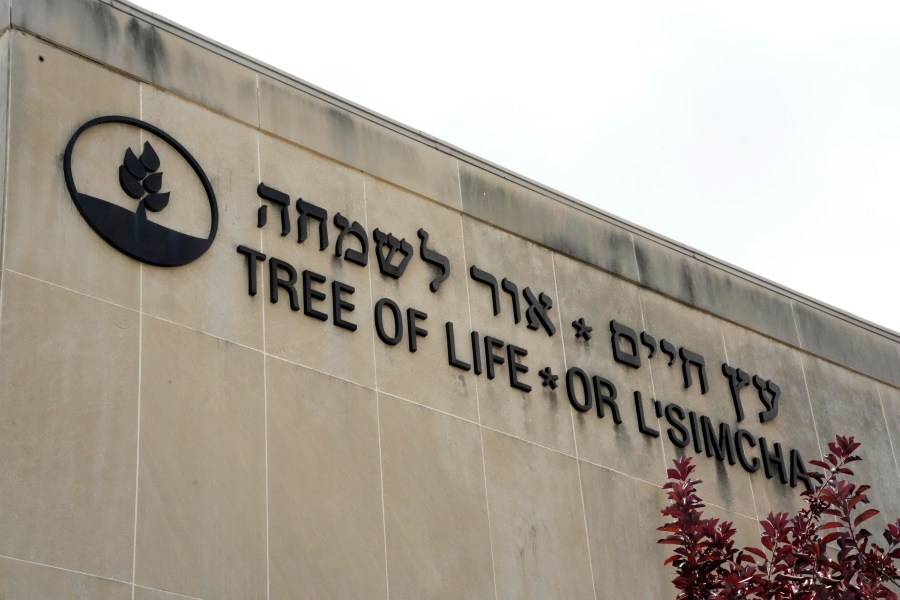 Signage marks the exterior of the dormant landmark Tree of Life synagogue in Pittsburgh's Squirrel Hill neighborhood on Thursday, July 13, 2023, the day a federal jury announced they had found Robert Bowers, who in 2018 killed 11 people at the synagogue, eligible for the death penalty. (AP Photo/Gene J. Puskar)