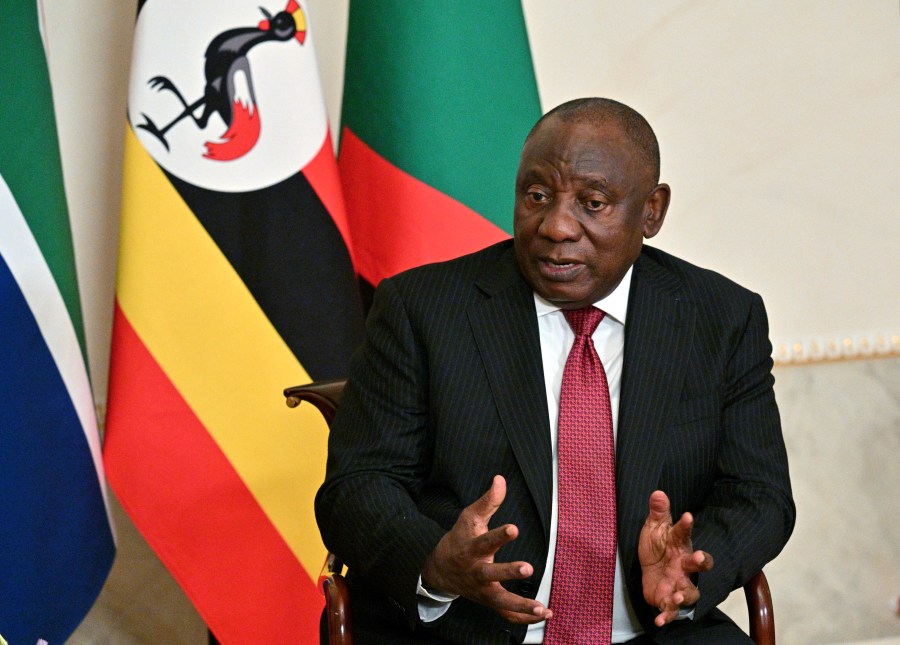 FILE - In this photo provided by Photo host Agency RIA Novosti, South African President Cyril Ramaphosa gestures while speaking to Russian President Vladimir Putin, not in photo, during their talks after a meeting in St. Petersburg, Russia, June 17, 2023. South Africa's president said Tuesday, July 18, 2023 that arresting Putin — should he show up at an economic summit next month in Johannesburg — would amount to a “declaration of war” by his country. (Ramil Sitdikov/Photo host Agency RIA Novosti via AP)