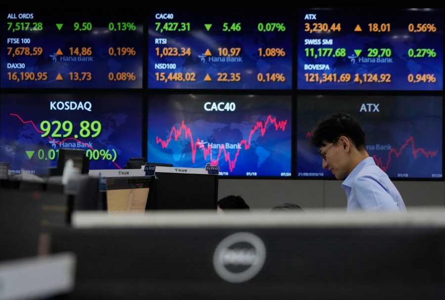 A currency trader watches monitors at the foreign exchange dealing room of the KEB Hana Bank headquarters in Seoul, South Korea, Tuesday, July 25, 2023. Asian stock markets followed Wall Street higher on Tuesday after China's ruling Communist Party promised to shore up its sagging economy ahead of a Federal Reserve meeting traders hope will announce this interest rate cycle's final increase. (AP Photo/Ahn Young-joon)