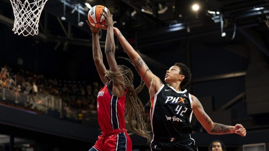 Phoenix Mercury center Brittney Griner (42) attempts to regain possession of the ball from Washington Mystics forward Queen Egbo during the first quarter of a WNBA basketball game, Sunday, July 23, 2023, in Washington. (AP Photo/Stephanie Scarbrough)