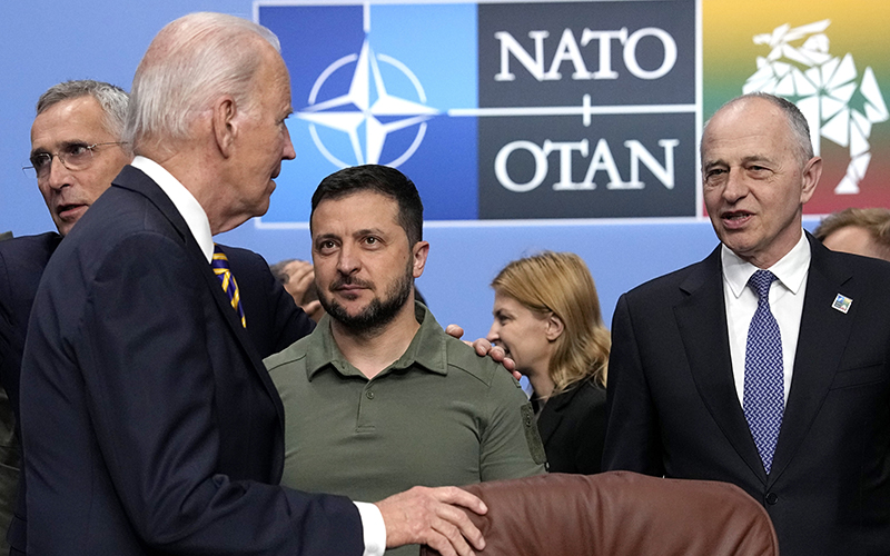 From left, NATO Secretary General Jens Stoltenberg, President Biden, Ukraine's President Volodymyr Zelenskyy and NATO Deputy Secretary General Mircea Geoana stand during a meeting of the NATO-Ukraine Council