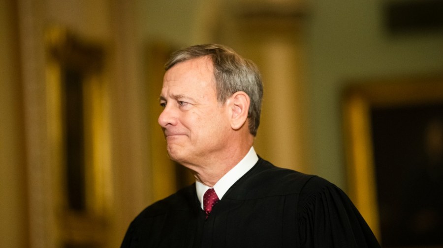 Chief Justice of the United States, John Roberts walks to the Senate chamber at the Capitol in Washington, Thursday, Jan. 16, 2020. (AP Photo/Matt Rourke)