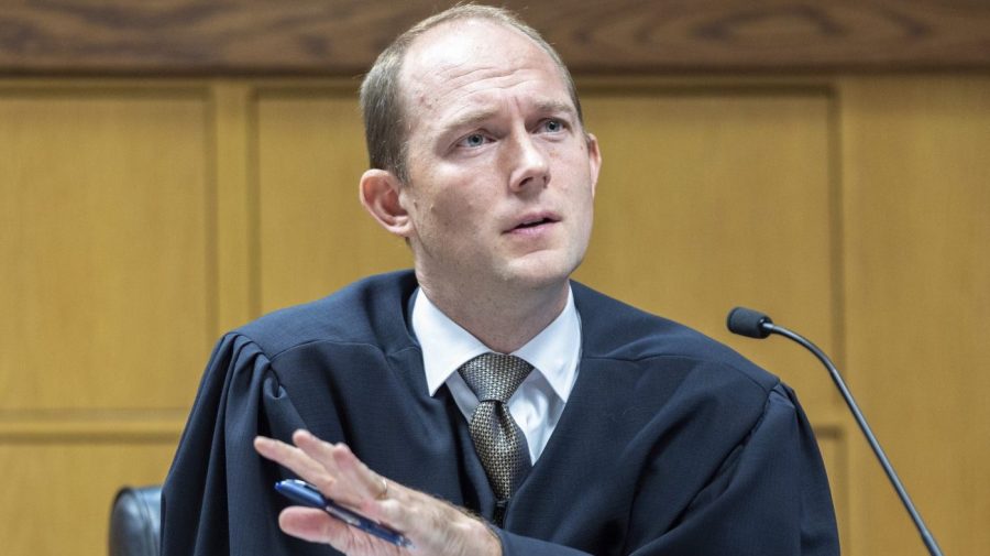 Fulton County Superior Court Judge Scott McAfee presides over a hearing regarding media access in the case against former President Donald Trump and 18 others at the Fulton County Courthouse in Atlanta, Thursday, Aug, 31, 2023. (Arvin Temkar/Atlanta Journal-Constitution via AP, Pool)