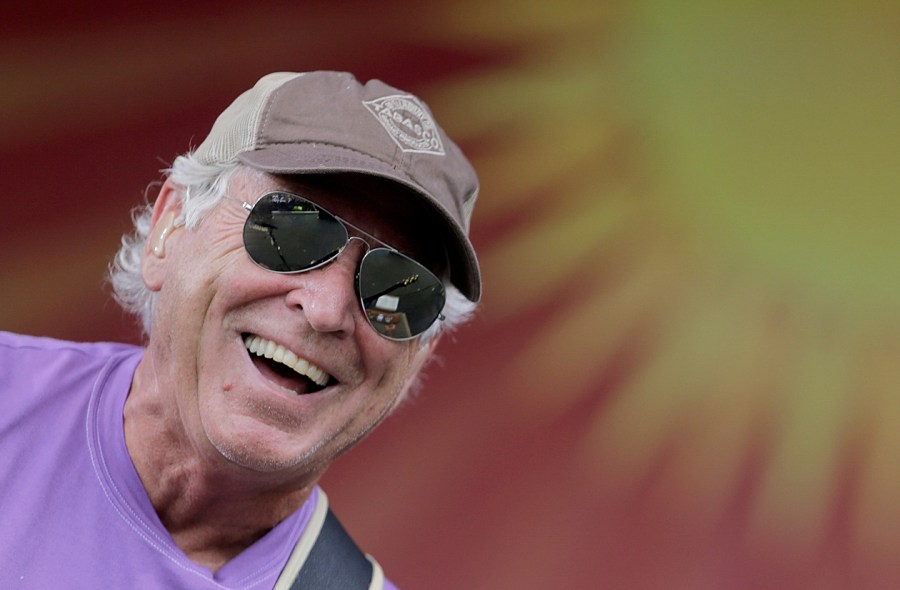 FILE - Jimmy Buffett performs on the Acura Stage during the New Orleans Jazz and Heritage Festival at the Fairgrounds in New Orleans Sunday, April 26, 2015. Buffett, who popularized beach bum soft rock with the escapist Caribbean-flavored song “Margaritaville” and turned that celebration of loafing into an empire of restaurants, resorts and frozen concoctions, has died, Friday, Sept. 1, 2023. (Brett Duke /The Times-Picayune/The New Orleans Advocate via AP)