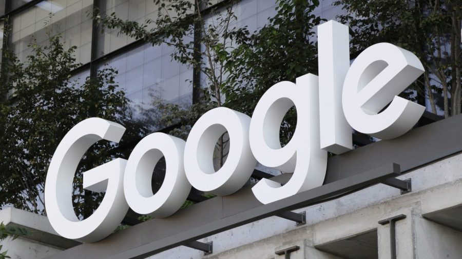 The Google sign is shown over an entrance to the company's new building in New York on Wednesday, Sept. 6, 2023. The U.S. government is taking aim at what has been an indomitable empire: Google’s ubiquitous search engine and the lucrative digital services hatched by its unwavering status as the internet’s main gateway. (AP Photo/Peter Morgan)