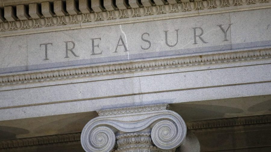 The U.S. Treasury Department building at dusk in Washington, June 6, 2019. The United States has slapped terrorism sanctions on a family network of seven individuals and businesses in Lebanon and South America accused of financing the militant group Hezbollah, including a Lebanese man who officials say was involved in two deadly attacks in Argentina in the 1990s. The sanctions were announced Tuesday by the U.S. Treasury Department. (AP Photo/Patrick Semansky, File)