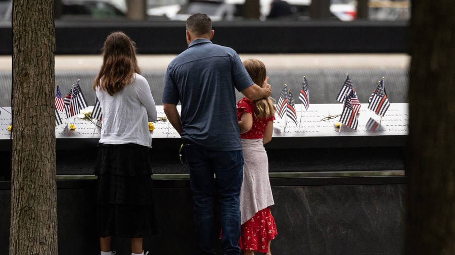 Relatives of the victims look at the 9/11 Memorial in New York City on September 11, 2022, on the 21st anniversary of the attacks on the World Trade Center, Pentagon, and Shanksville, Pennsylvania.