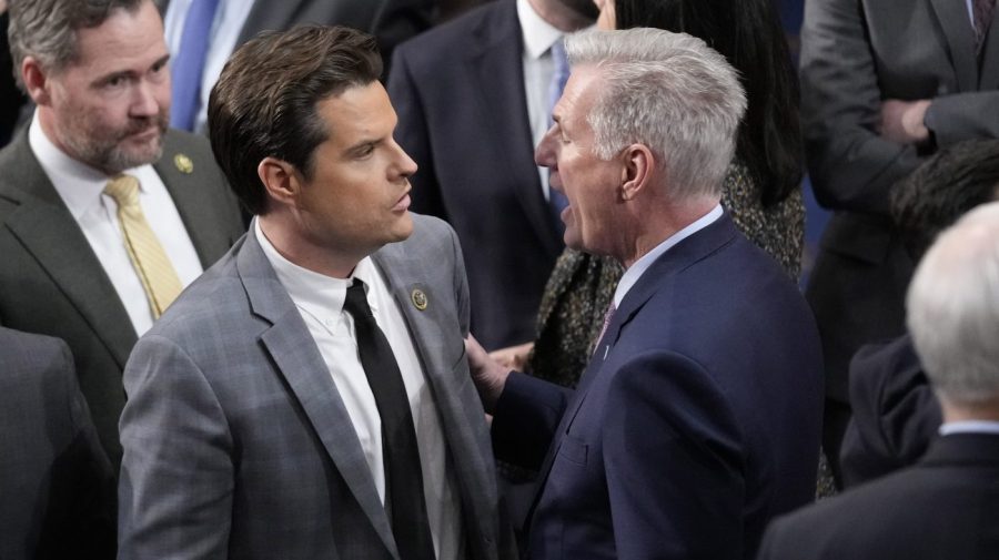 Representative Kevin McCarthy speaks with Representative Matt Gaetz in the House Chamber.