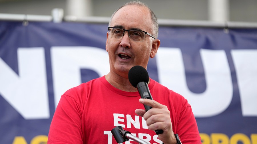 Shawn Fain speaks at a rally.