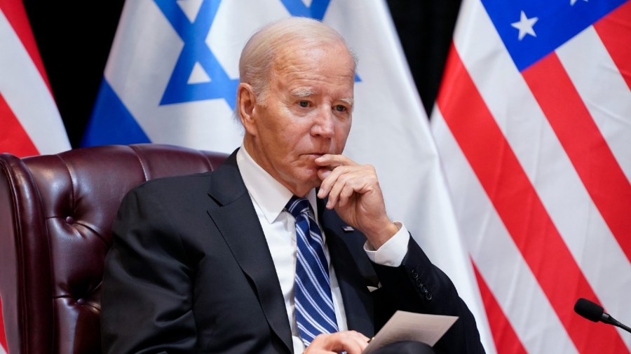 President Joe Biden listens as he and Israeli Prime Minister Benjamin Netanyahu participate in an expanded bilateral meeting with Israeli and U.S. government officials, Wednesday, Oct. 18, 2023, in Tel Aviv.