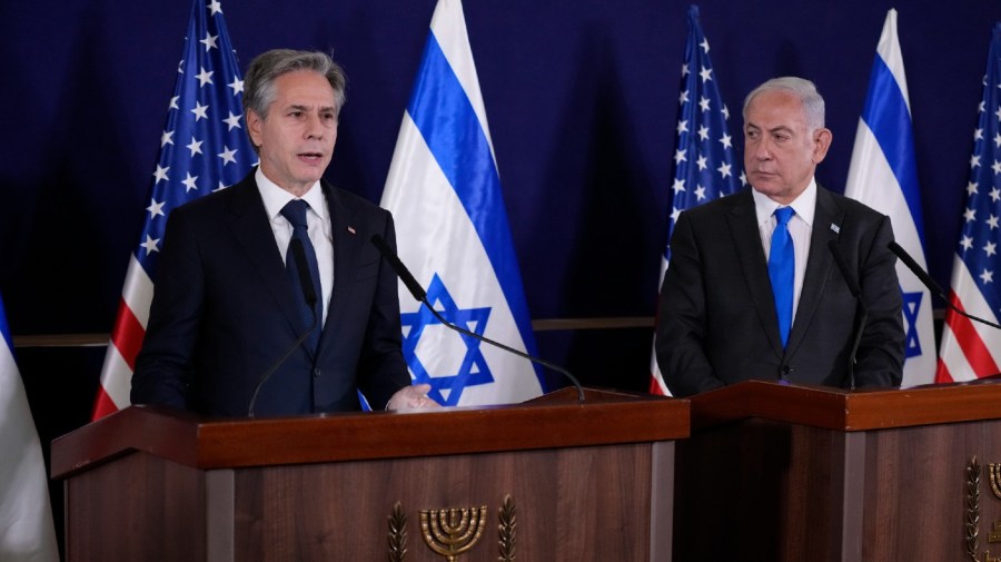 U.S. Secretary of State Antony Blinken, left, and Israel's Prime Minister Benjamin Netanyahu make statements to the media inside The Kirya, which houses the Israeli Ministry of Defense, after their meeting in Tel Aviv, Thursday Oct. 12, 2023.