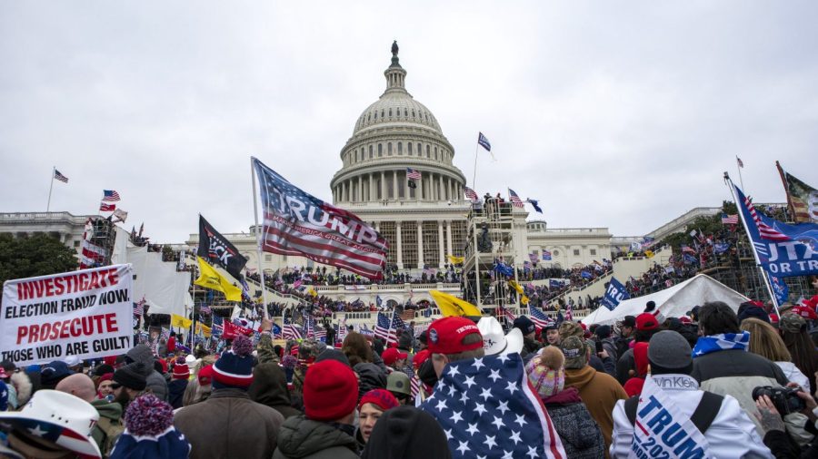 FILE - Insurrections loyal to President Donald Trump rally at the U.S. Capitol in Washington on Jan. 6, 2021. Lawsuits playing out in two states this week seeking to keep former President Donald Trump off the ballot rely on a constitutional clause barring those from office who “have engaged in insurrection.” One challenge has become clear during the hearings in Colorado and Minnesota: No one can agree on how to define an insurrection. (AP Photo/Jose Luis Magana, File)