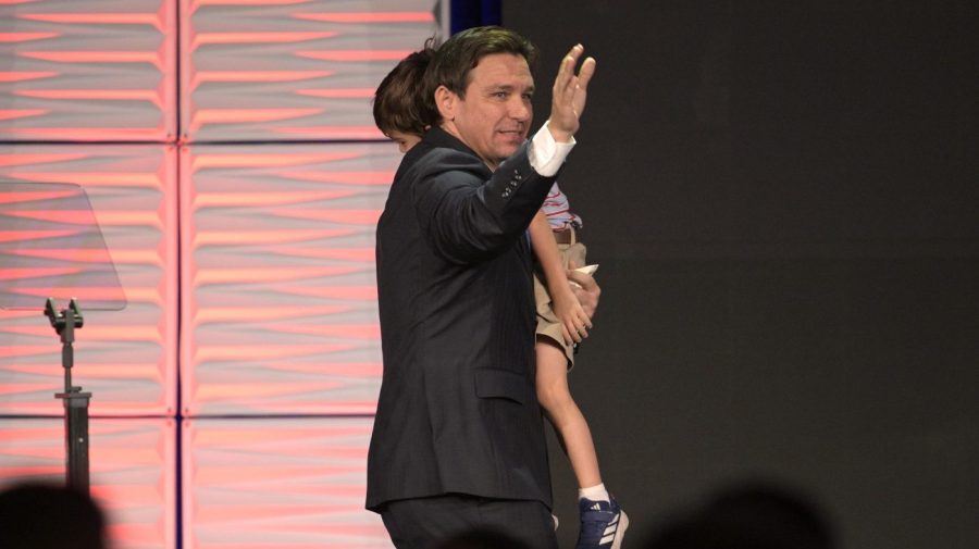 Republican presidential candidate Florida Gov. Ron DeSantis waves to attendees, while carrying his son Mason, after speaking at the Republican Party of Florida Freedom Summit, Saturday, Nov. 4, 2023, in Kissimmee, Fla. (AP Photo/Phelan M. Ebenhack)