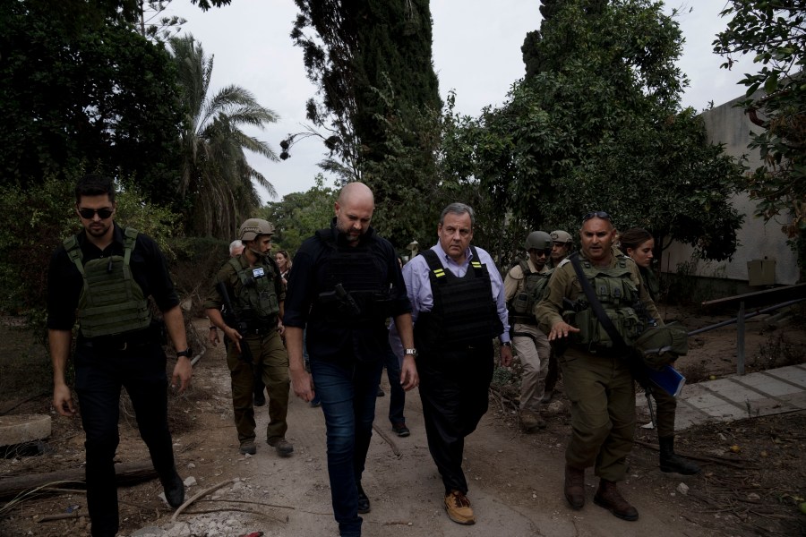 Former New Jersey Governor Chris Christie, front second right, visits Kibbutz Kfar Azza, near the Israel-Gaza border, the site of an Oct. 7 massacre by Hamas, with Israel's Knesset Speaker Amir Ohana, front second left and Israeli Army Maj. Diamond, front right, Sunday, Nov. 12, 2023. (AP Photo/Maya Alleruzzo)