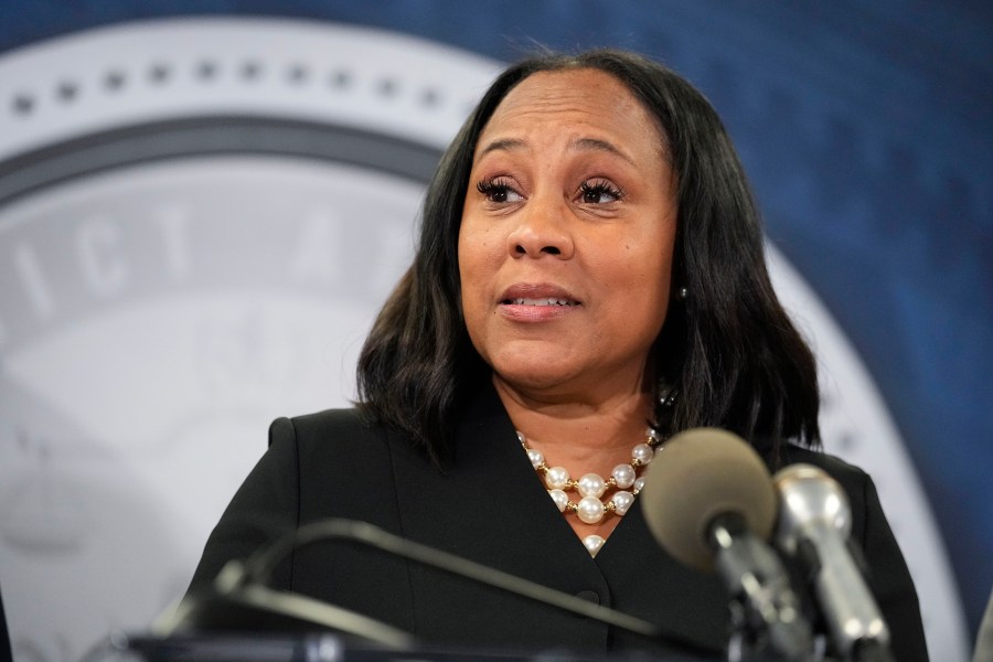 FILE - Fulton County District Attorney Fani Willis speaks in the Fulton County Government Center during a news conference, Aug. 14, 2023, in Atlanta. An Alabama man has been indicted on federal charges that he threatened violence against the Georgia prosecutor and Fulton County, Ga., Sheriff Patrick Labat related to an investigation into former President Donald Trump. The indictment was returned Wednesday, Oct. 25, 2023, and unsealed Monday, Oct. 30. (AP Photo/John Bazemore, File)