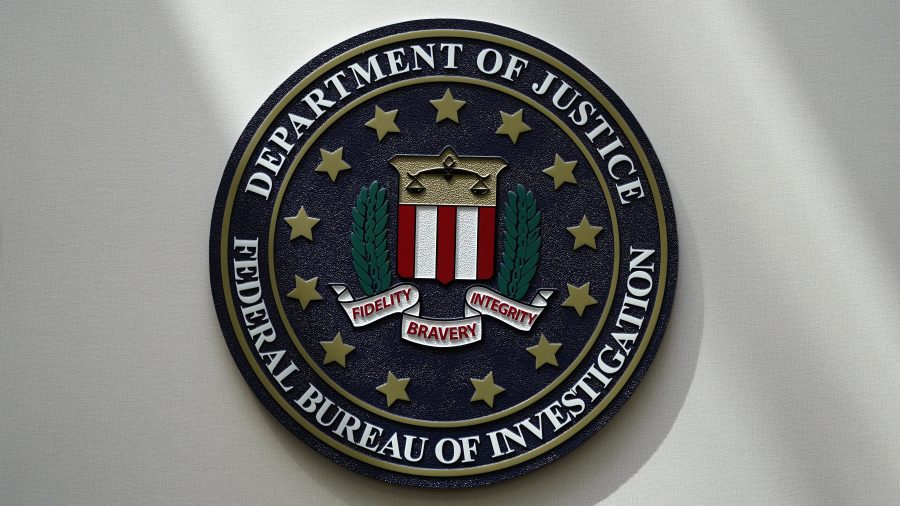 FILE - The FBI seal is pictured in Omaha, Neb., Aug. 10, 2022. A Utah man has been charged with threatening a Palestinian rights organization in Washington. The case was unsealed Monday, Nov. 20, 2023, as tensions rise in the U.S. from the devastating war between Israel and Hamas. (AP Photo/Charlie Neibergall, File)