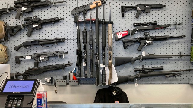 Firearms are displayed at a gun shop.