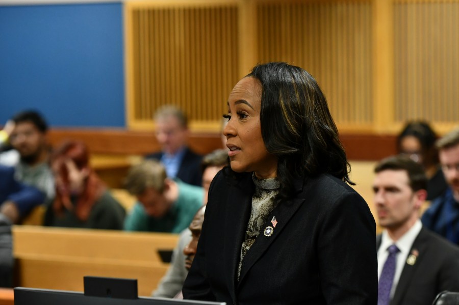 Fulton County District Attorney Fani Willis addresses the court during a hearing regarding defendant Harrison Floyd, a leader in the organization Black Voices for Trump, as part of the Georgia election indictments, Tuesday, Nov. 21, 2023, in Atlanta. Fulton County Superior Court Judge Scott McAfee heard arguments Tuesday on a request to revoke Floyd's bond, of one of former President Donald Trump's co-defendants in the Georgia case related to efforts to overturn the 2020 election. Willis, in a motion filed last week, says that Floyd has been attempting to intimidate and contact likely witnesses and his co-defendants in violation of the terms of his release. (Dennis Byron/Hip Hop Enquirer via AP)