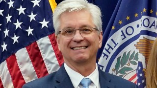 FILE - Federal Reserve Board of Governors member Christopher Waller poses for a photo on May 23, 2022, in Washington. Waller said Tuesday, Nov. 28, 2023 that the U.S. economy is cooling and inflation is steadily slowing, suggesting that the Fed's interest rate policies are succeeding in getting price increases back to the central bank's 2%. (AP Photo/Patrick Semansky, File)