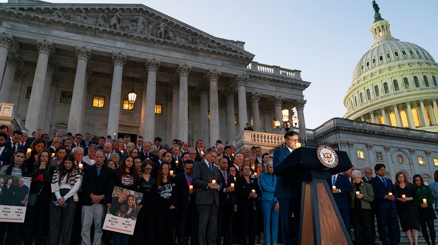 Members of the House, families of Israeli victims and hostages hold a vigil outside the House Chamber