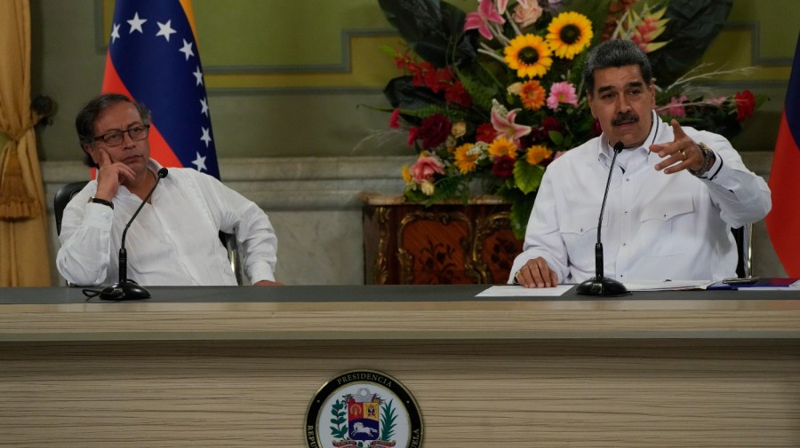 Venezuelan President Nicolas Maduro, right, accompanied by Colombia's President Gustavo Petro, speaks at a joint press conference at the Miraflores Presidential Palace in Caracas, Venezuela, Saturday, Nov. 18, 2023. (AP Photo/Ariana Cubillos)