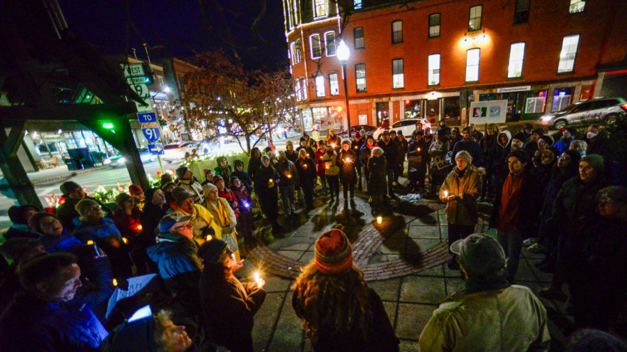 People gather in Pliny Park in Brattleboro, Vt., for a vigil, Monday, Nov. 27, 2023, for the three Palestinian-American students who were shot while walking near the University of Vermont campus in Burlington, Vt., Saturday, Nov. 25.