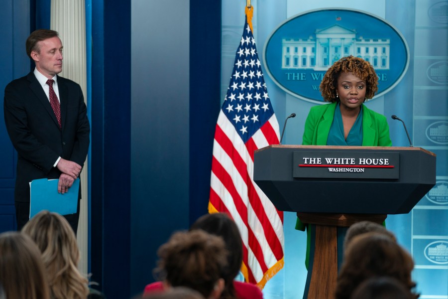 White House national security adviser Jake Sullivan listens as White House press secretary Karine Jean-Pierre speaks during a press briefing at the White House, Monday, Dec. 4, 2023, in Washington. (AP Photo/Evan Vucci)