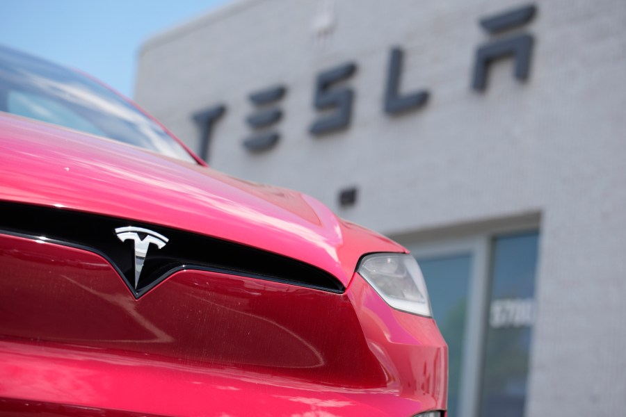 File - An unsold 2023 Model X sports-utility vehicle sits outside a Tesla dealership June 18, 2023, in Littleton, Colo. Tesla is recalling more than 2 million vehicles across its model lineup to fix a defective system that's supposed to ensure drivers are paying attention when they use Autopilot. (AP Photo/David Zalubowski, File)