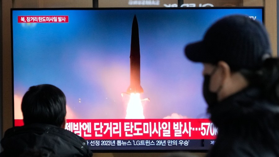 A TV screen shows a file image of North Korea's missile launch during a news program at the Seoul Railway Station in Seoul, South Korea, Monday, Dec. 18, 2023.