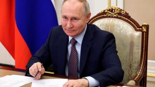 FILE - Russian President Vladimir Putin takes part in the opening ceremony of the Vostok (East) M-12 motorway to Kazan, via videoconference, in Moscow, Russia, Thursday, Dec. 21, 2023. Putin on Thursday, Jan. 4, 2024 signed a decree allowing for a quicker path to Russian citizenship for foreigners who enlist in the country's army amid the special military operation in Ukraine. (Mikhail Klimentyev, Sputnik, Kremlin Pool Photo via AP, File)
