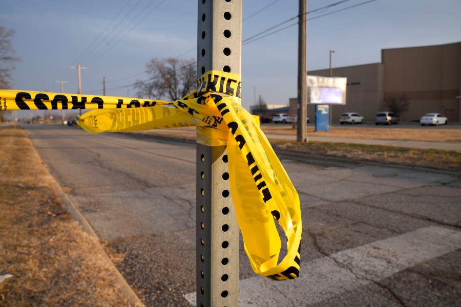 Sheriff's tape is seen on a post outside of Perry High School following a shooting Thursday at the school, Friday, Jan. 5, 2024, in Perry, Iowa. (AP Photo/Charlie Neibergall)