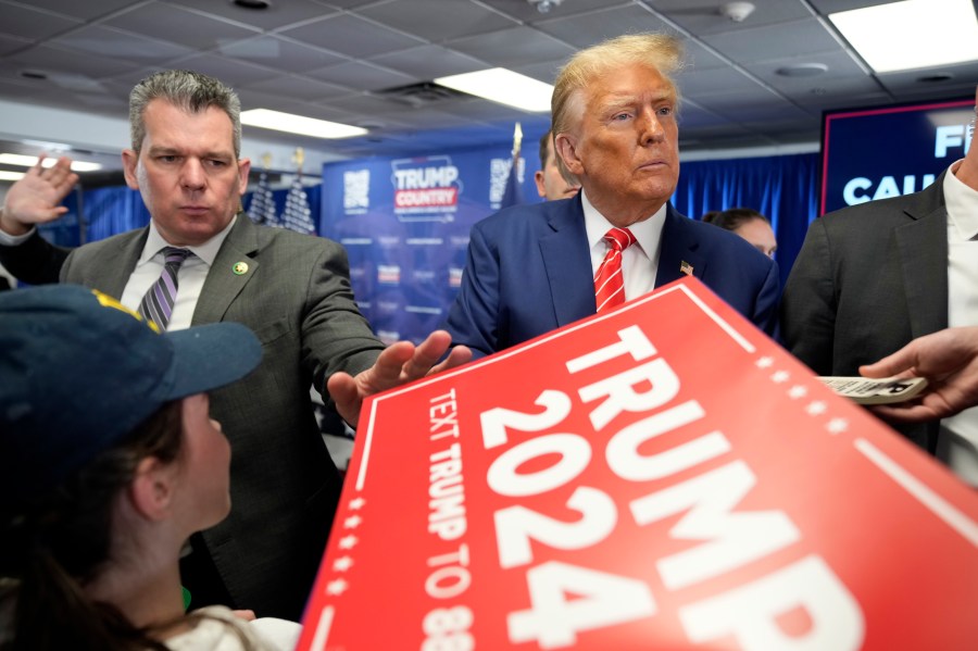 Republican presidential candidate former President Donald Trump signs autographs after speaking at a rally at Des Moines Area Community College in Newton, Iowa, Saturday, Jan. 6, 2024. (AP Photo/Andrew Harnik)