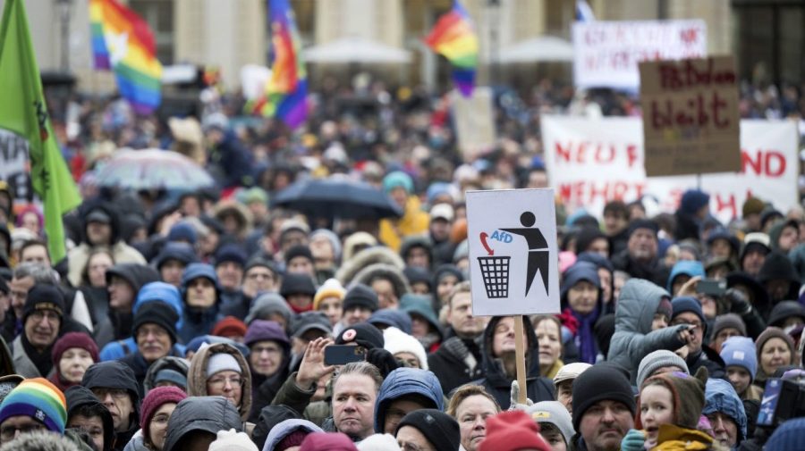 People stand on the Alter Markt square during the "Potsdam defends itself" demonstrations in Potsdam, near Berlin, Germany, Sunday, Jan. 14, 2024. Thousands of people gathered in Germany Sunday for demonstrations against the far right, among them Chancellor Olaf Scholz and his foreign minister, following a report that extremists recently met to discuss the deportation of millions of immigrants and others if they took power. (Sebastian Christoph Gollnow/dpa via AP)