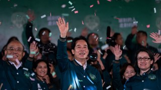 Taiwanese Vice President Lai Ching-te, also known as William Lai, left, celebrates his victory with running mate Bi-khim Hsiao in Taipei, Taiwan, Saturday, Jan. 13, 2024. The Ruling-party candidate has emerged victorious in Taiwan's presidential election and his opponents have conceded. (AP Photo/Louise Delmotte)