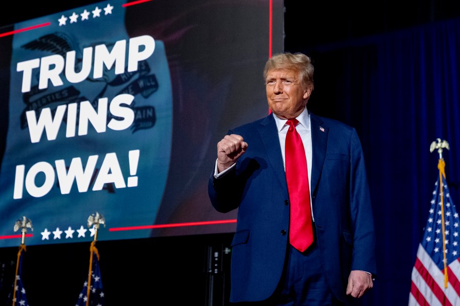 Republican presidential candidate former President Donald Trump takes the stage at a caucus night party in Des Moines, Iowa, Monday, Jan. 15, 2024. (AP Photo/Andrew Harnik)