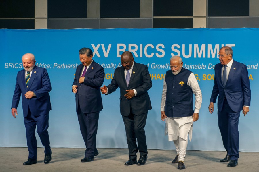 From left, Brazil's President Luiz Inacio Lula da Silva, China's President Xi Jinping, South Africa's President Cyril Ramaphosa, India's Prime Minister Narendra Modi and Russia's Foreign Minister Sergei Lavrov pose for a BRICS group photo during the 2023 BRICS Summit in Johannesburg, South Africa, Aug. 23, 2023.