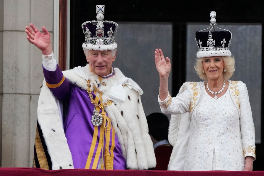 FILE - Britain's King Charles III and Queen Camilla wave to the crowds from the balcony of Buckingham Palace after the coronation ceremony in London, May 6, 2023. When it comes to the United Kingdom's royal family, the Americans can't seem to get enough. That was evident this week, following the announcement of King Charles III's treatment for cancer on Monday, Feb. 5, 2024. (AP Photo/Frank Augstein, File)